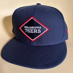 Philadelphia 76ers Navy Blue Snapback (2023-24 City Edition)